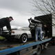 Loading the car on the trailer to move to America. For the body of the car—which came from Massachusetts—this was somewhat of a homecoming!
